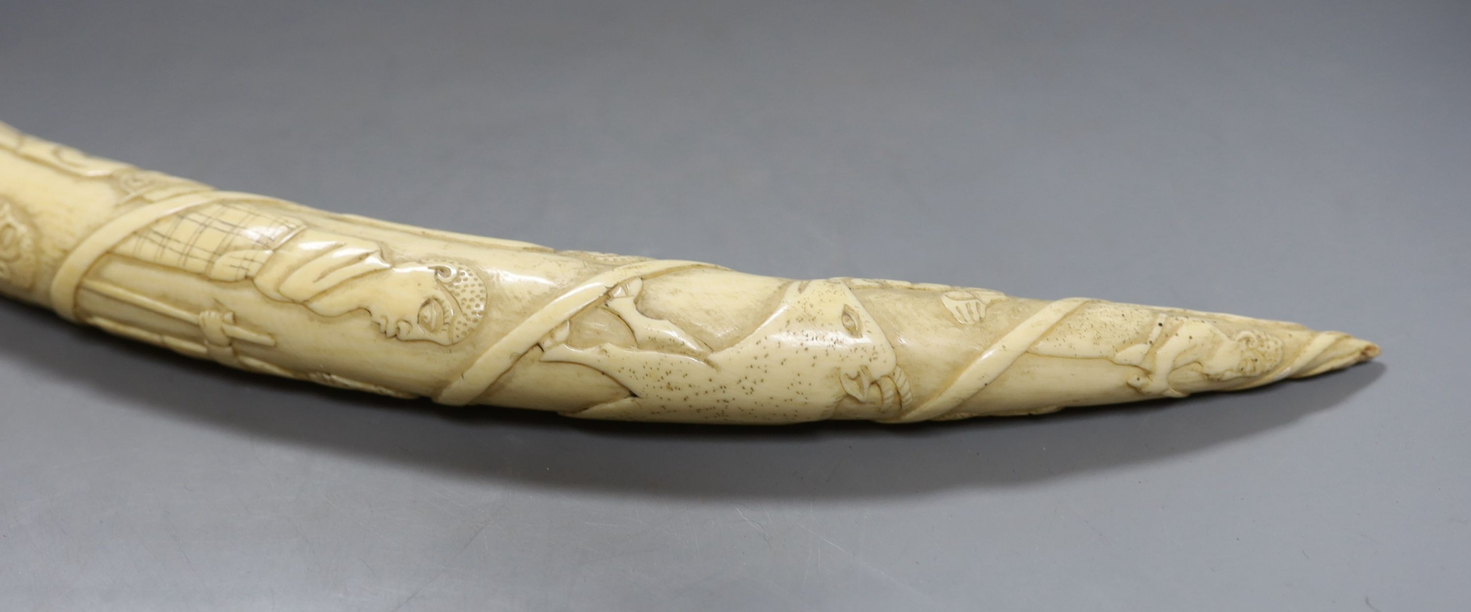 A 19th-century Luango tribal carved ivory tusk, Democratic Republic of Congo, 53 cm long